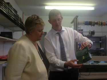 Heather Wheeler MP and Jonathan Portus examining a computer motherboard